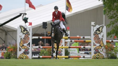 Harry Meade and Annaghmore Valoner jump a fence in the showjumping on the way to third at Badminton 2026.