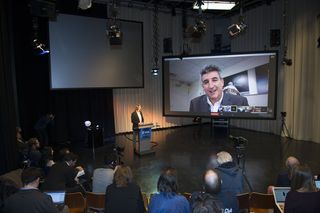At a press conference Feb. 9, researchers gathered in Noordwijk, Netherlands, to announce Asteroid Day 2016. The European Space Agency's director of technical and quality management, Franco Ongaro, is pictured on the screen.