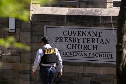 Police officer outside Covenant School.