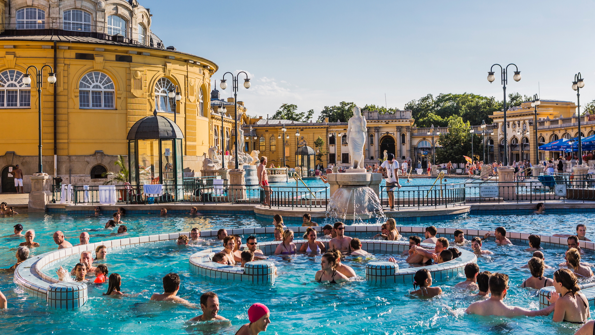 People swimming at Széchenyi Baths in Budapest