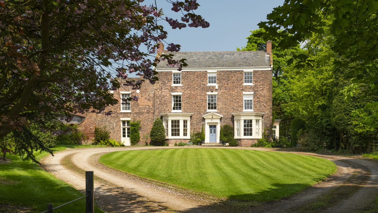 Exterior of Georgian farmhouse in spring