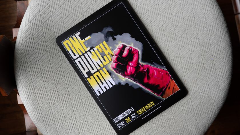 A TCL NXTPAPER 11 Plus tablet with the first page of One-Punch Man on screen