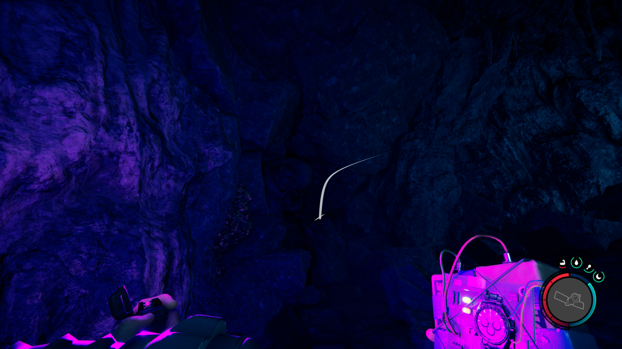 Sons of the Forest - a large monster stuck in a crevice while a player aims a time bomb at it