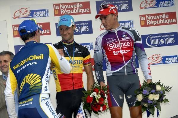 Borut Bozic is welcomed to the podium by Tom Boonen and Philippe Gilbert.
