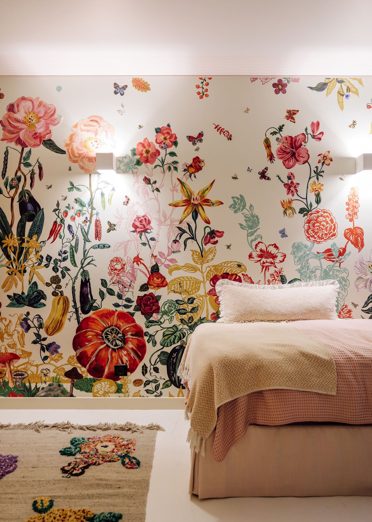 Pink and yellow bedding, pink red yellow, blue and green flower wallpaper and rug