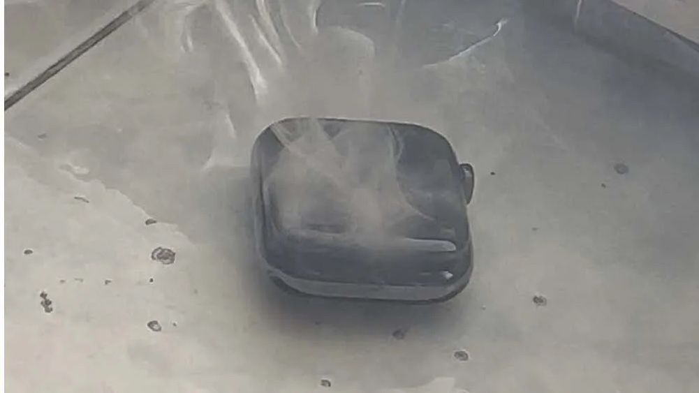 Apple Watch Series 7 with smoke coming out of it