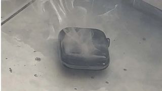 Apple Watch Series 7 with smoke coming out of it
