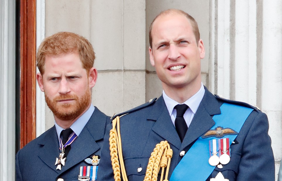 Prince Harry, Duke of Sussex and Prince William, Duke of Cambridge watch a flypast to mark the centenary of the Royal Air Force from the balcony of Buckingham Palace on July 10, 2018 in London, England