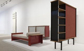 A trio of Prouvé furniture - bed, cupboard and console