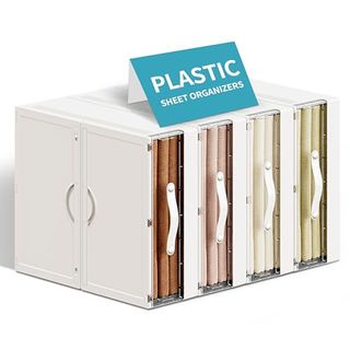 Four vertically stacked plastic sheet organizers with pull handles and a window to view what's inside visible on right side of picture