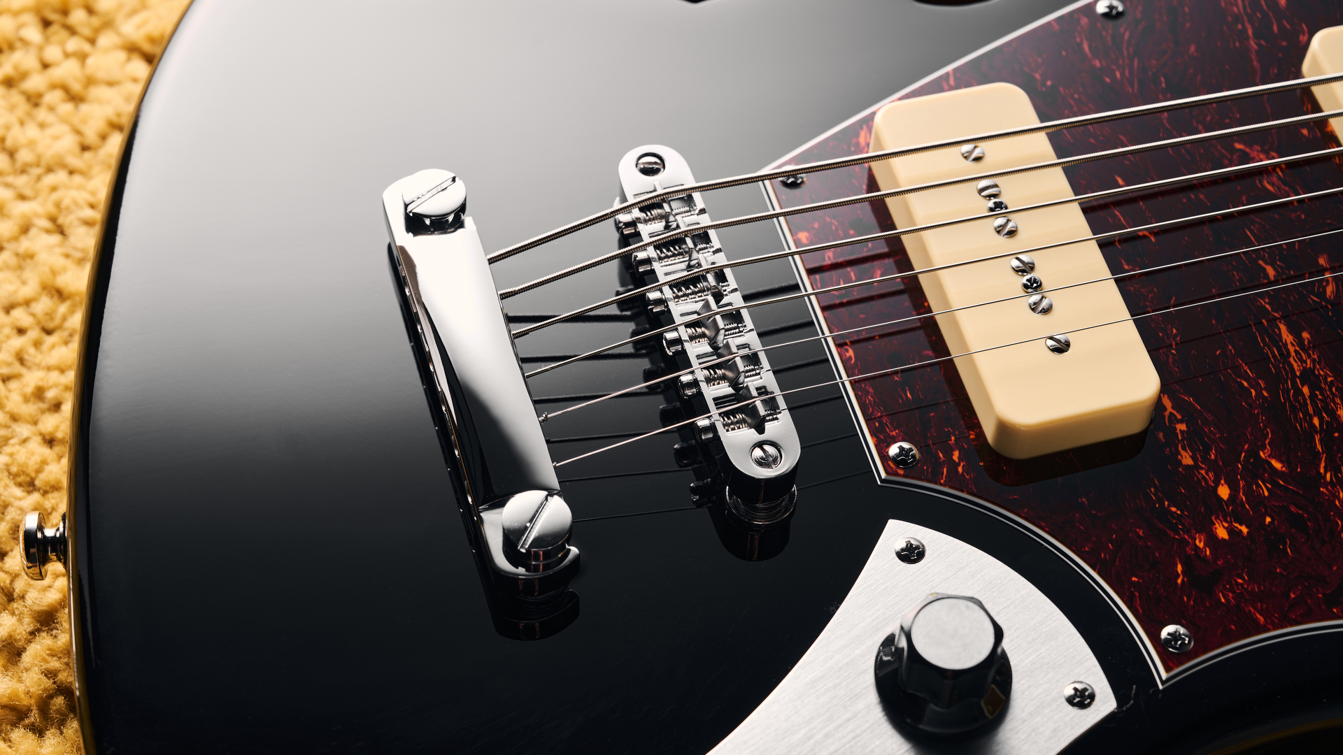 The bridge and bridge pickup on the Orangewood Del Sol Baritone guitar