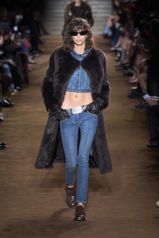 Woman in jeans and brogues on Miu Miu runway