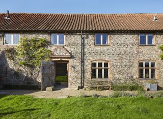 exterior of flint-and-brick house