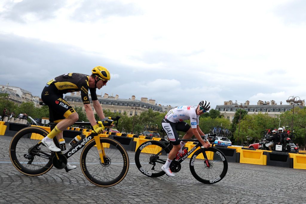 UAE Team Emirates Slovenian rider Tadej Pogacar R and JumboVismas Belgian rider Nathan Van Hooydonck cycle in a breakaway on the Champs Elysee avenue during the 21st and final stage of the 110th edition of the Tour de France cycling race 115 km between SaintQuentinenYvelines and the ChampsElysees in Paris on July 23 2023 Photo by Thomas SAMSON AFP Photo by THOMAS SAMSONAFP via Getty Images