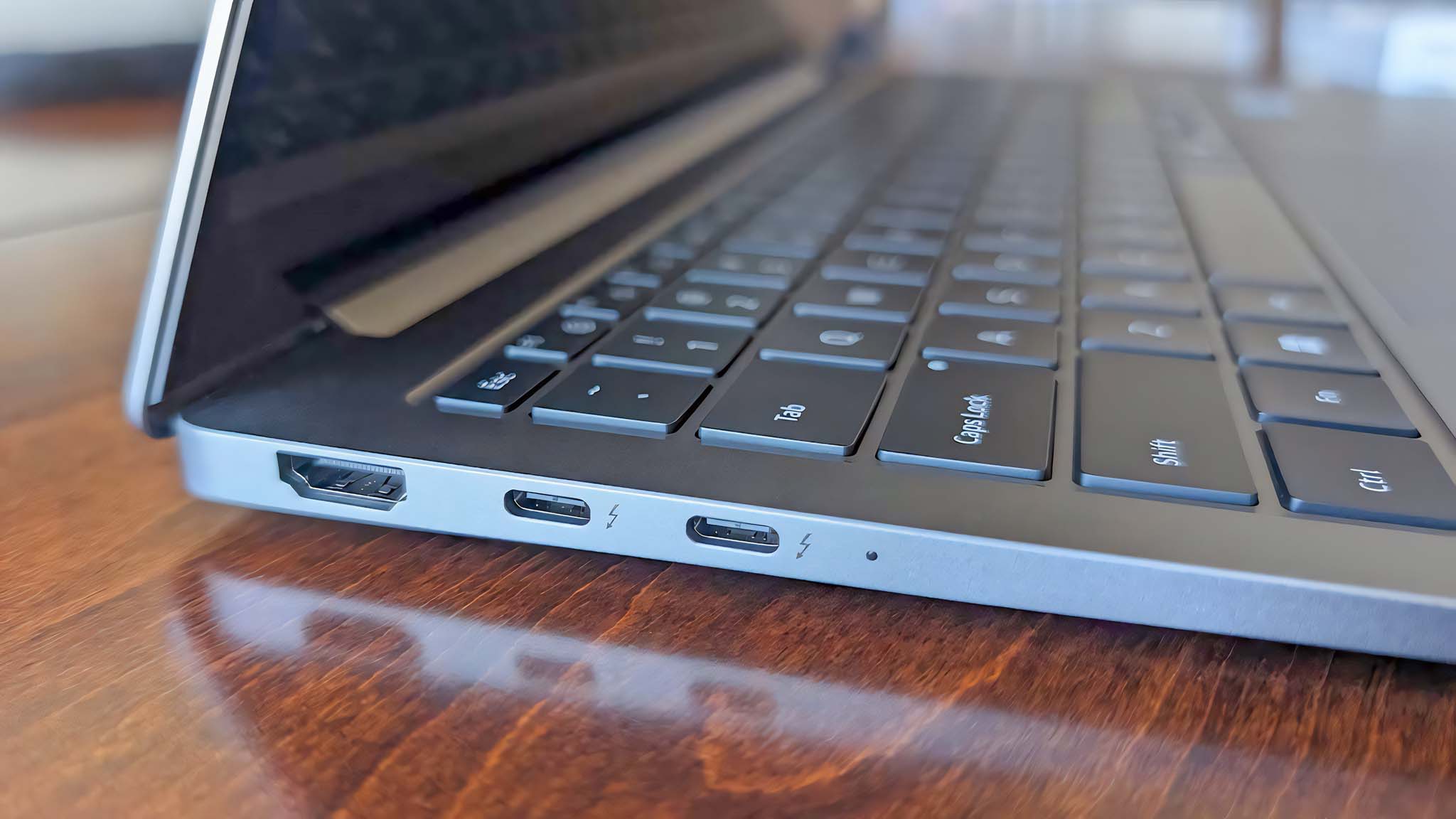 A closeup shot of the HDMI port and two USB-C ports on the Samsung Galaxy Book5 Pro's right side. 