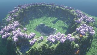Minecraft seeds - a cherry blossom forest rings the top of a valley with a lake