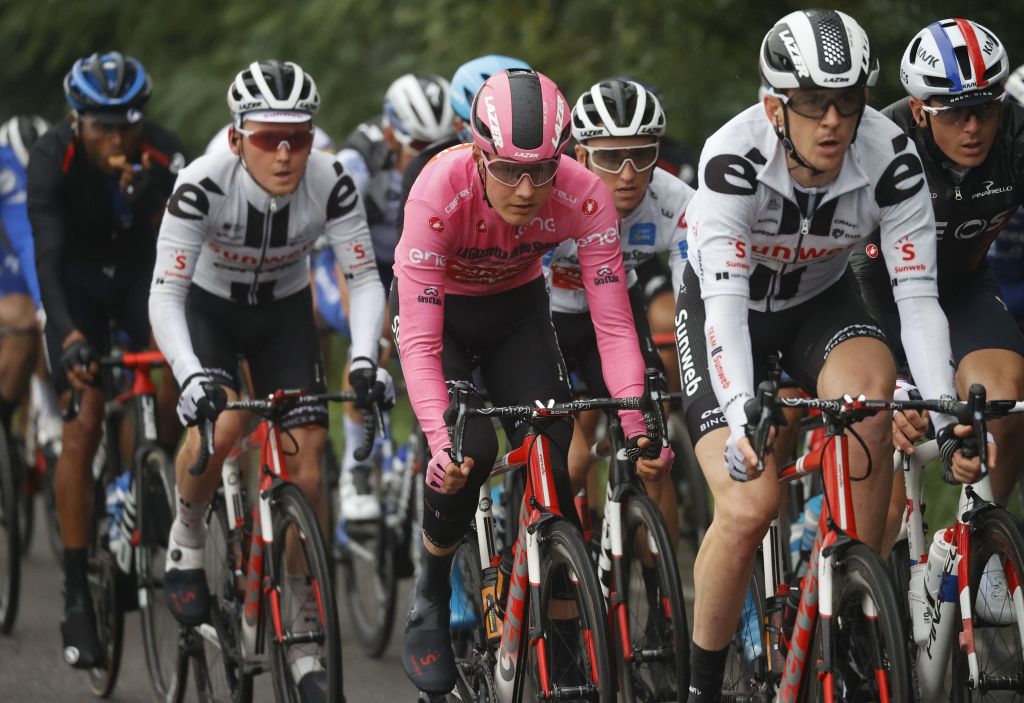 Team Sunweb rider Netherlands Wilco Kelderman C wearing the overall leaders pink jersey rides with the pack during the 19th stage of the Giro dItalia 2020 cycling race a 258kilometer route between Morbegno and Asti on October 23 2020 Heavy rain has interrupted on October 23 2020 the 19th stage of the Giro dItalia following protests by the riders in the face of difficult weather conditions Todays stage was planned to be a flat 258km ride between Morbegno and Asti but was cut back 100km after riders revolted when faced with pelting rain in the northern region of Lombardy Photo by Luca Bettini AFP Photo by LUCA BETTINIAFP via Getty Images