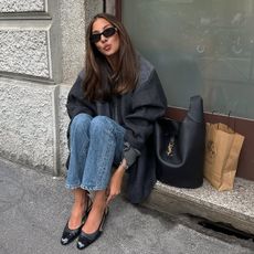 @fakerstrom wears a Saint Laurent bag, blue jeans and a grey jacket