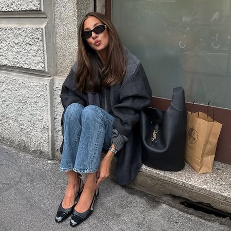 @fakerstrom wears a Saint Laurent bag, blue jeans and a grey jacket