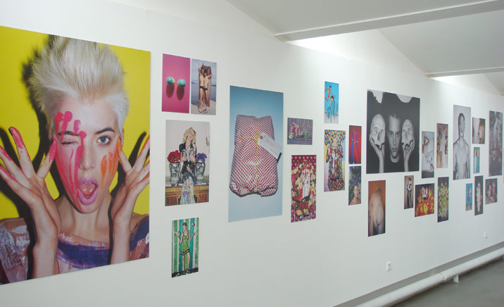 Walter Pfieffer’s ’Mischievous’ exhibition. A white wall with photographs on it.