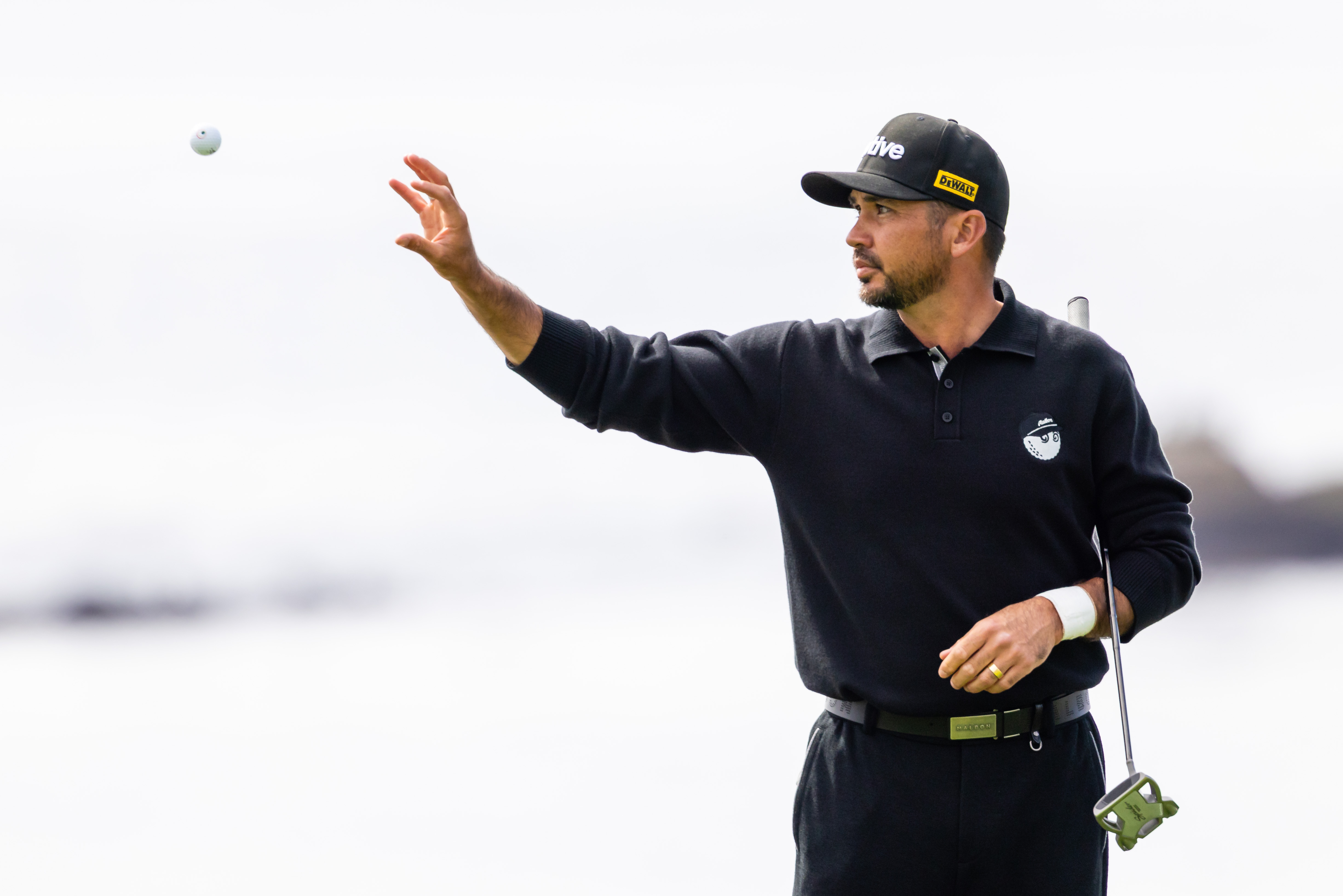 Jason Day catches a golf ball