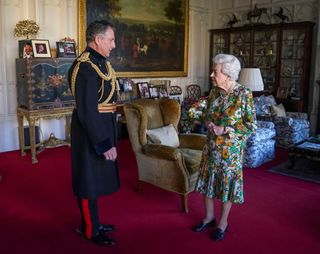 Queen Elizabeth II greets Britain's Chief of the Defence Staff, General Nick Carter, during an audience at Windsor Castle