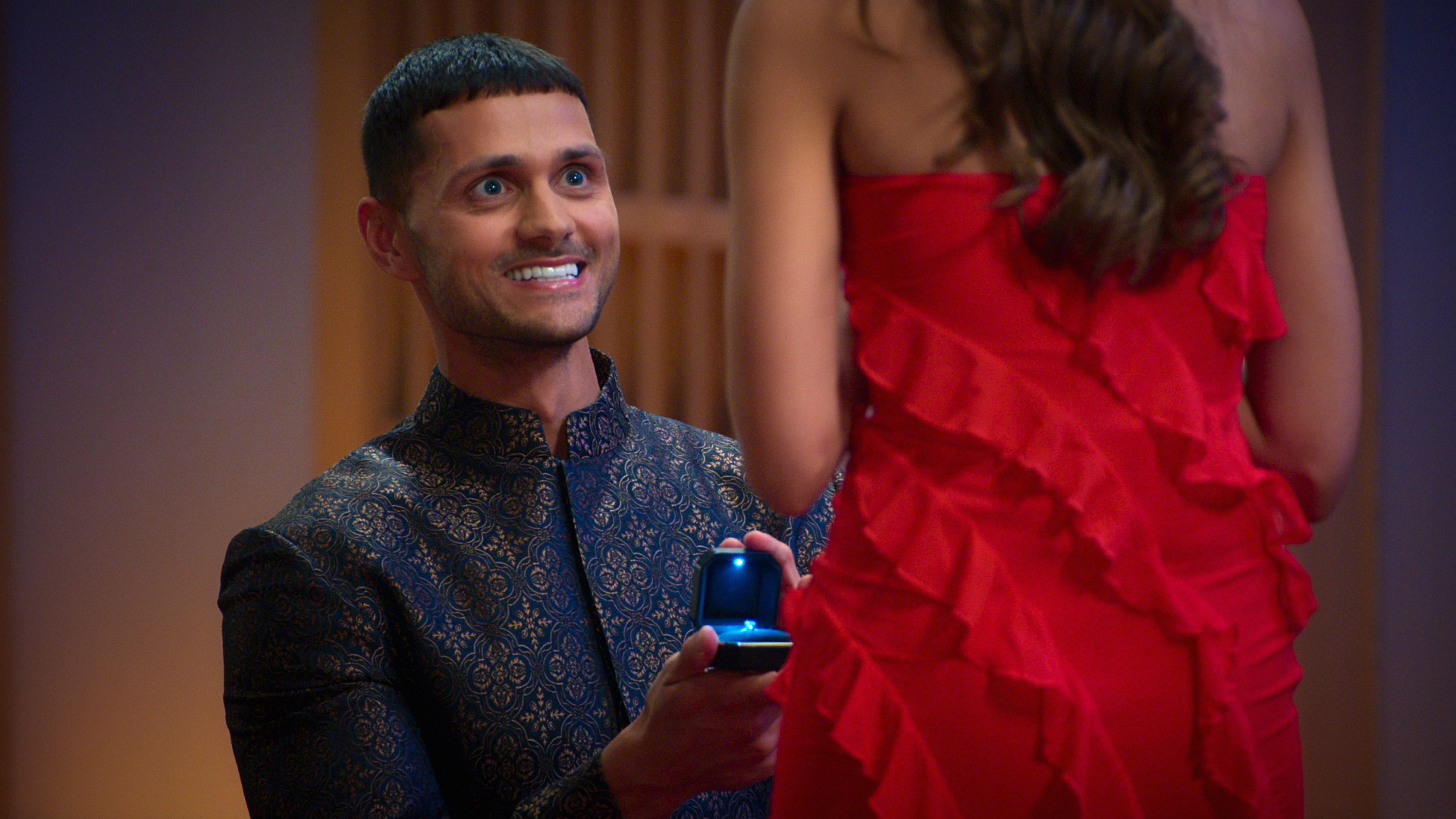 kal proposes to sarover smilling and holding a ring in love is blind uk season 2