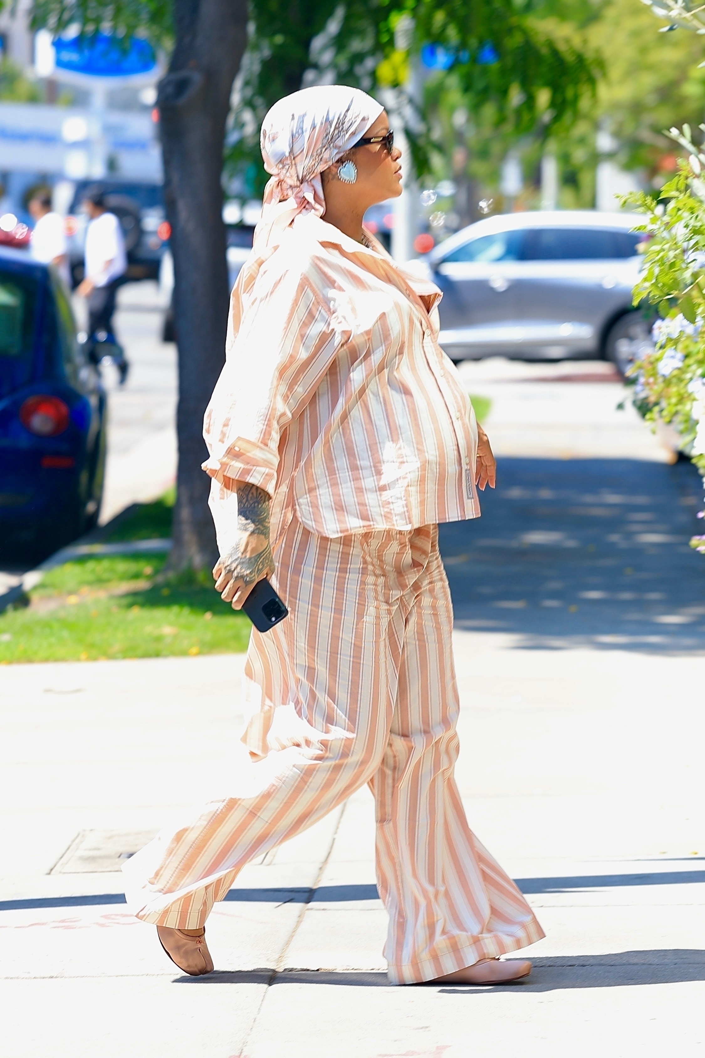 Rihanna styled a pinstripe pajama set with Maison Margiela Tabi flats