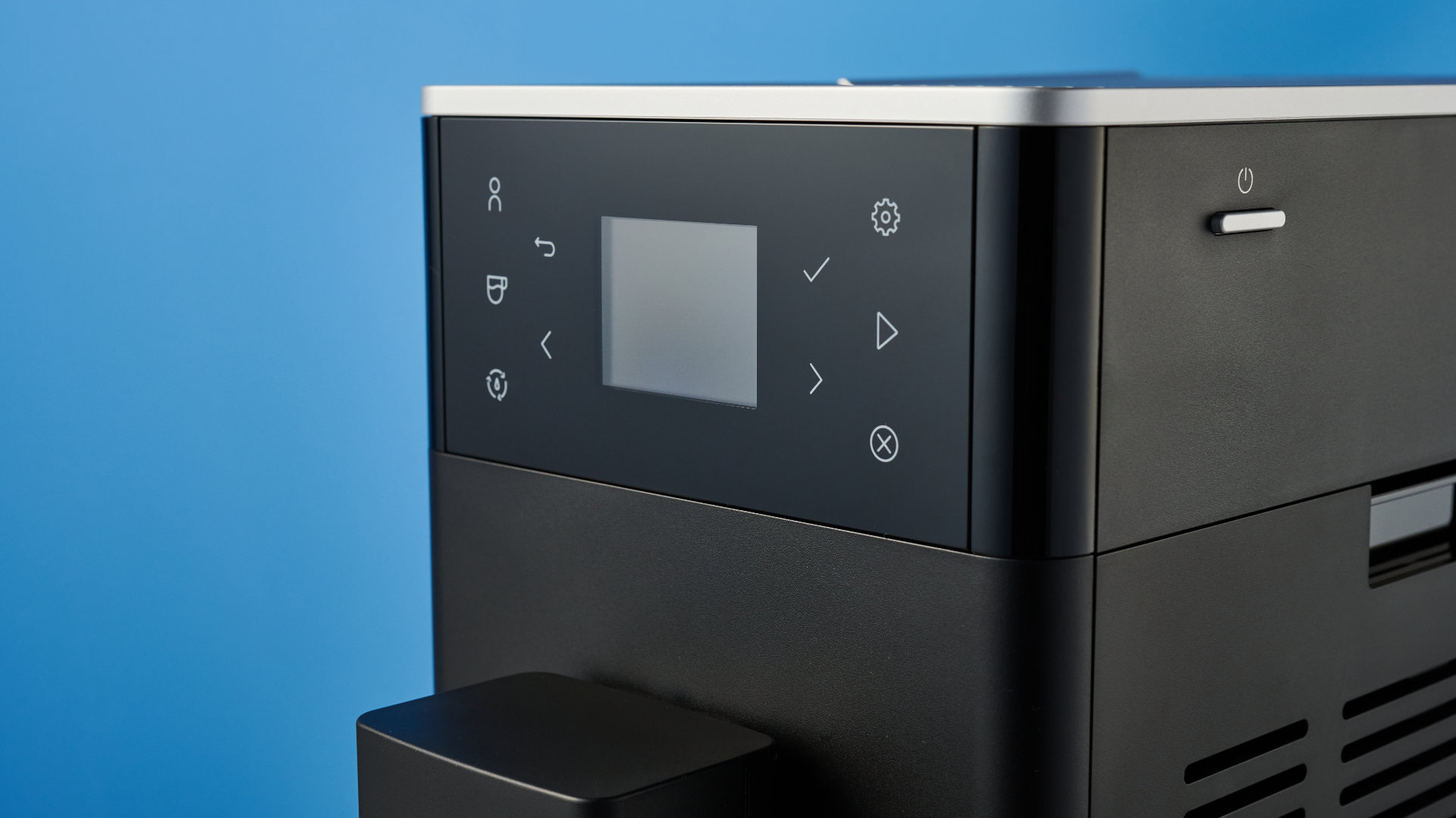 the kitchenaid kf3 superautomatic coffee machine photographed against a blue tom's guide background