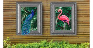 Slatted wooden garden fence with framed outdoor art for a quirky outdoor living room idea