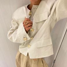 @annaaborisovna in an H&M Linen jacket with gold buttons