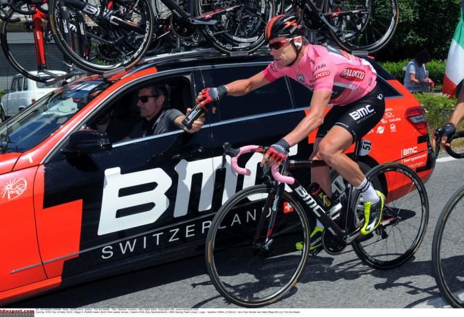 Cadel Evans (BMC) drops back to the team car