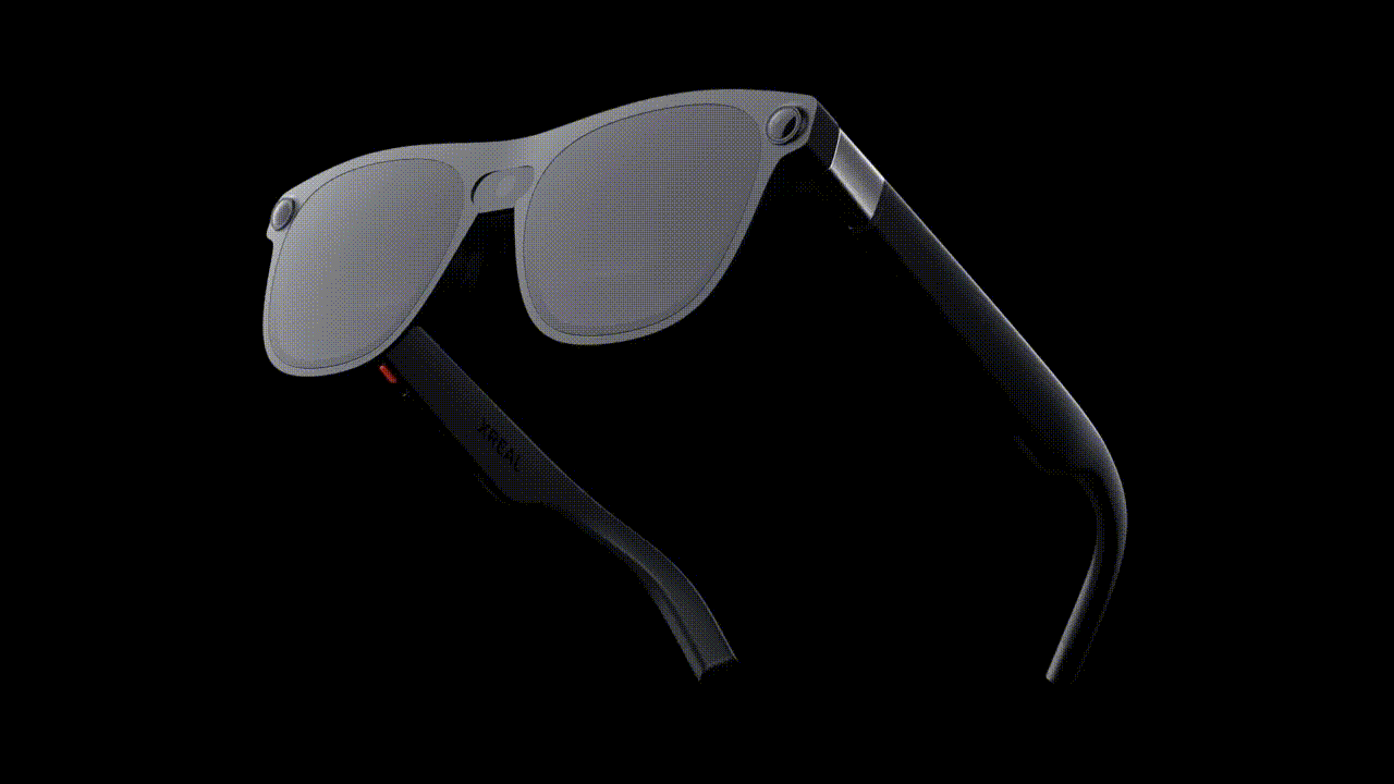 An animated gif of the XREAL Project Aura glasses floating on a black background.
