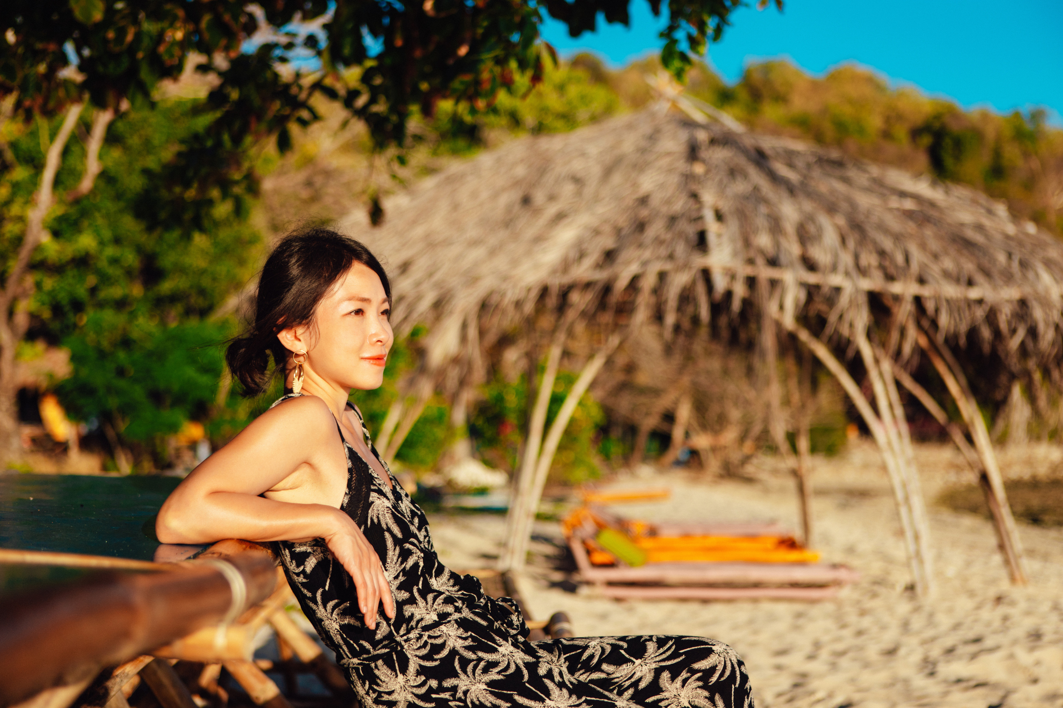 Filipina woman enjoying wellness retreat. Concept of sustainable tourism and eco holiday, or retiring in the Philippines.