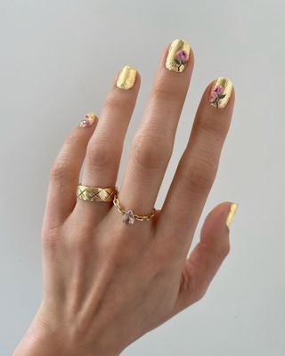 Gold nail polish design.