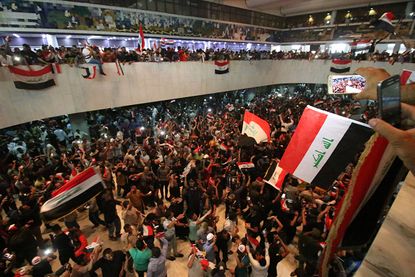 Protesters demonstrate in Iraqi parliament building