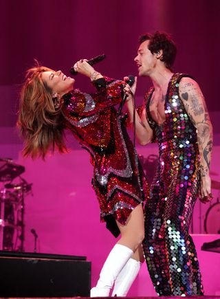 Shania Twain and Harry Styles perform onstage at the Coachella Stage during the 2022 Coachella Valley Music And Arts Festival on April 15, 2022 in Indio, California