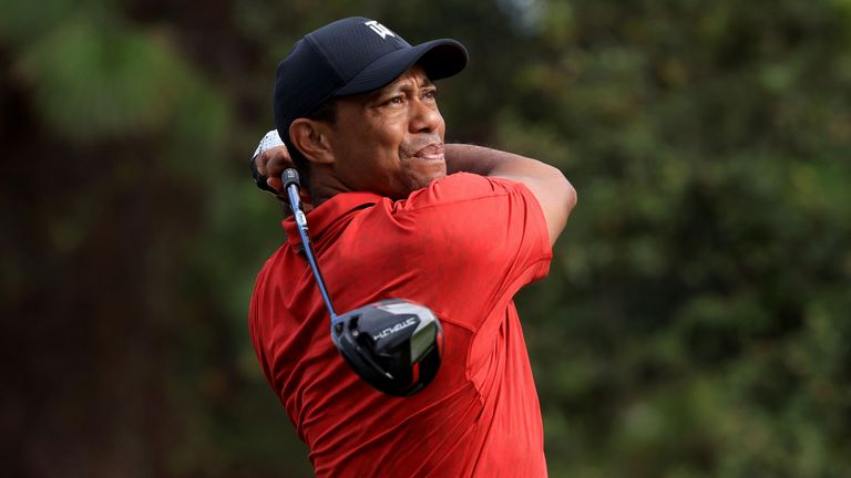 Tiger Woods holds his finish after hitting a drive at the PNC Championship