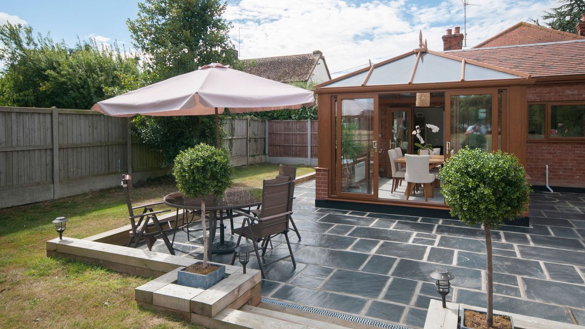 slate paved patio with table and chairs