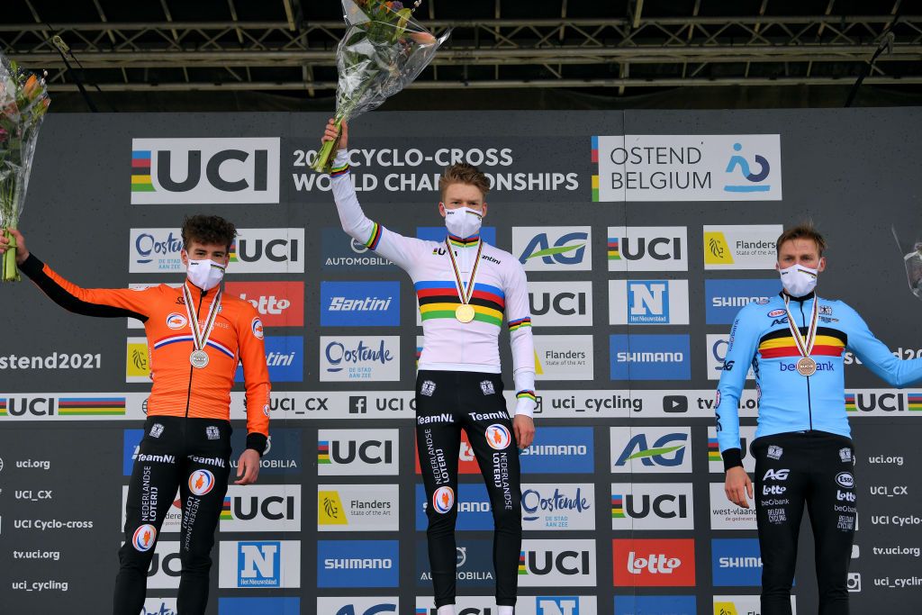 OOSTENDE BELGIUM JANUARY 30 Podium Ryan Kamp of The Netherlands Silver medal Pim Ronhaar of The Netherlands World Champion Jersey Gold medal and Timo Kielich of Belgium Bronze medal Celebration Rainbow Jersey Mask Covid safety measures during the 72nd UCI CycloCross World Championships Oostende 2021 Men U23 UCICX CXWorldCup Ostend2021 CX on January 30 2021 in Oostende Belgium Photo by Luc ClaessenGetty Images