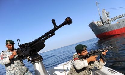Soldiers take part in Iranian naval maneuvers near Iran's Strait of Hormuz: Tehran has threatened to block the busy oil-shipping route, through which 17 million barrels of oil travel every da