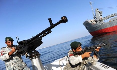 Soldiers take part in Iranian naval maneuvers near Iran&amp;#039;s Strait of Hormuz: Tehran has threatened to block the busy oil-shipping route, through which 17 million barrels of oil travel every da