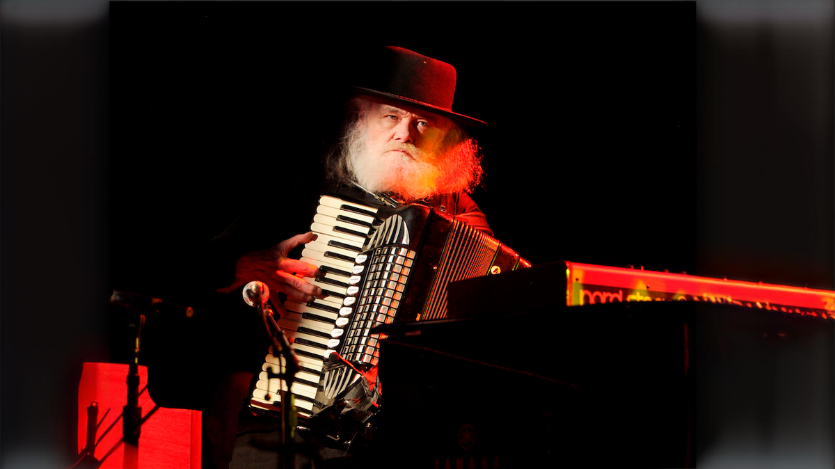 Garth Hudson onstage with an accordion