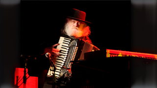 Garth Hudson onstage with an accordion