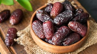 dates in wooden bowl