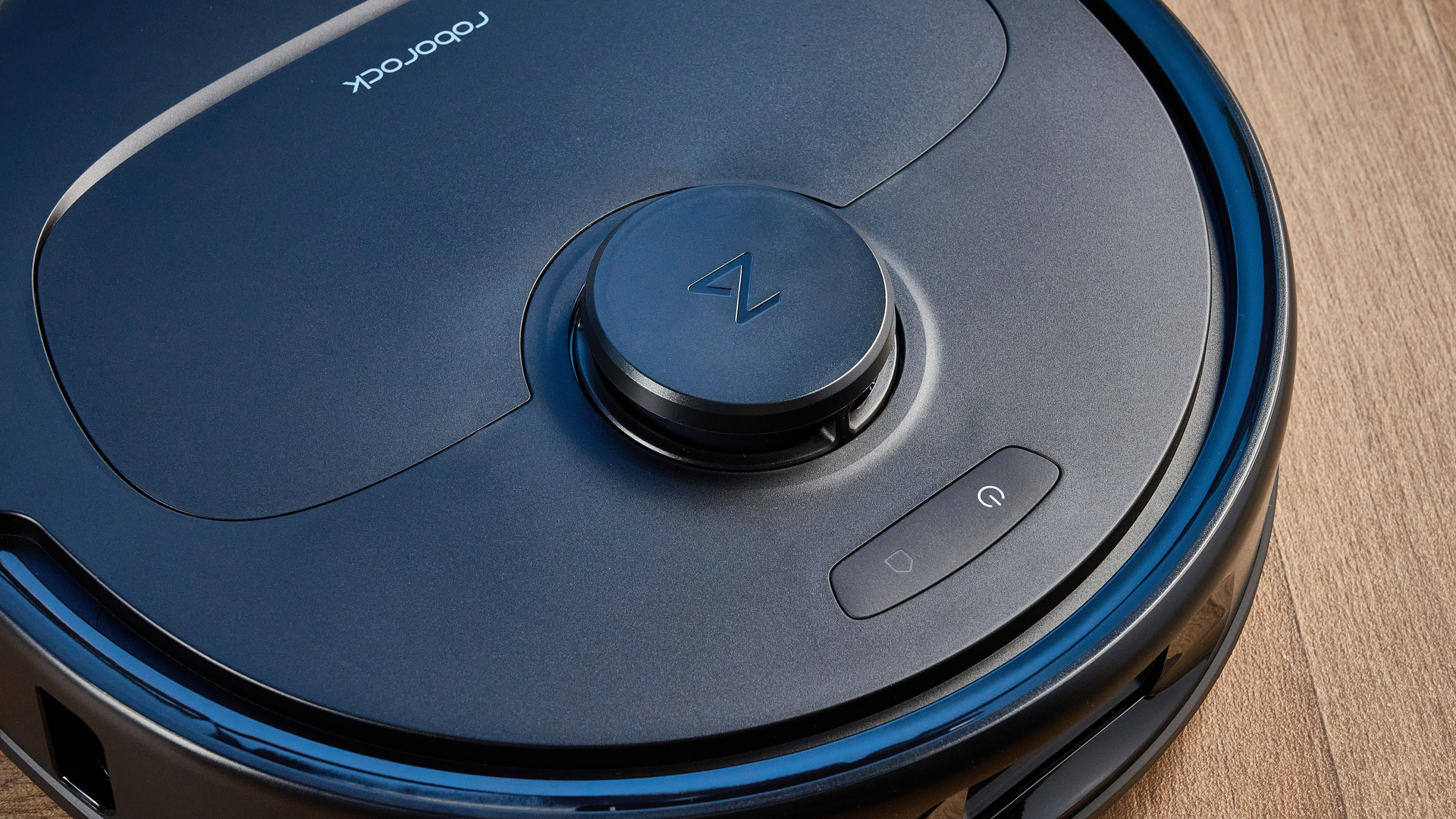 Roborock QV 35S photographed in front of a blue background