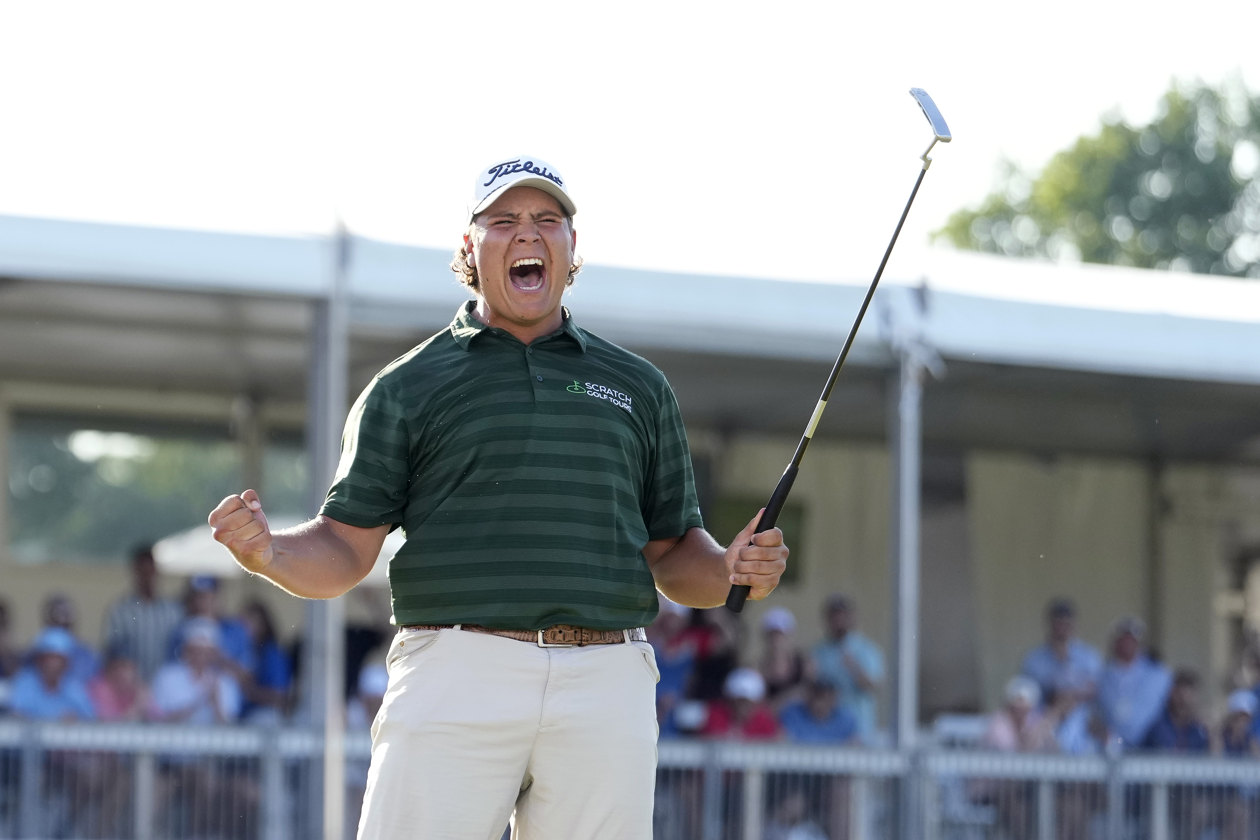 Aldrich Potgieter fist pumps after holing a putt