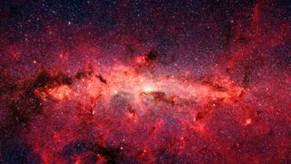 a red field of bright gas on a starry background