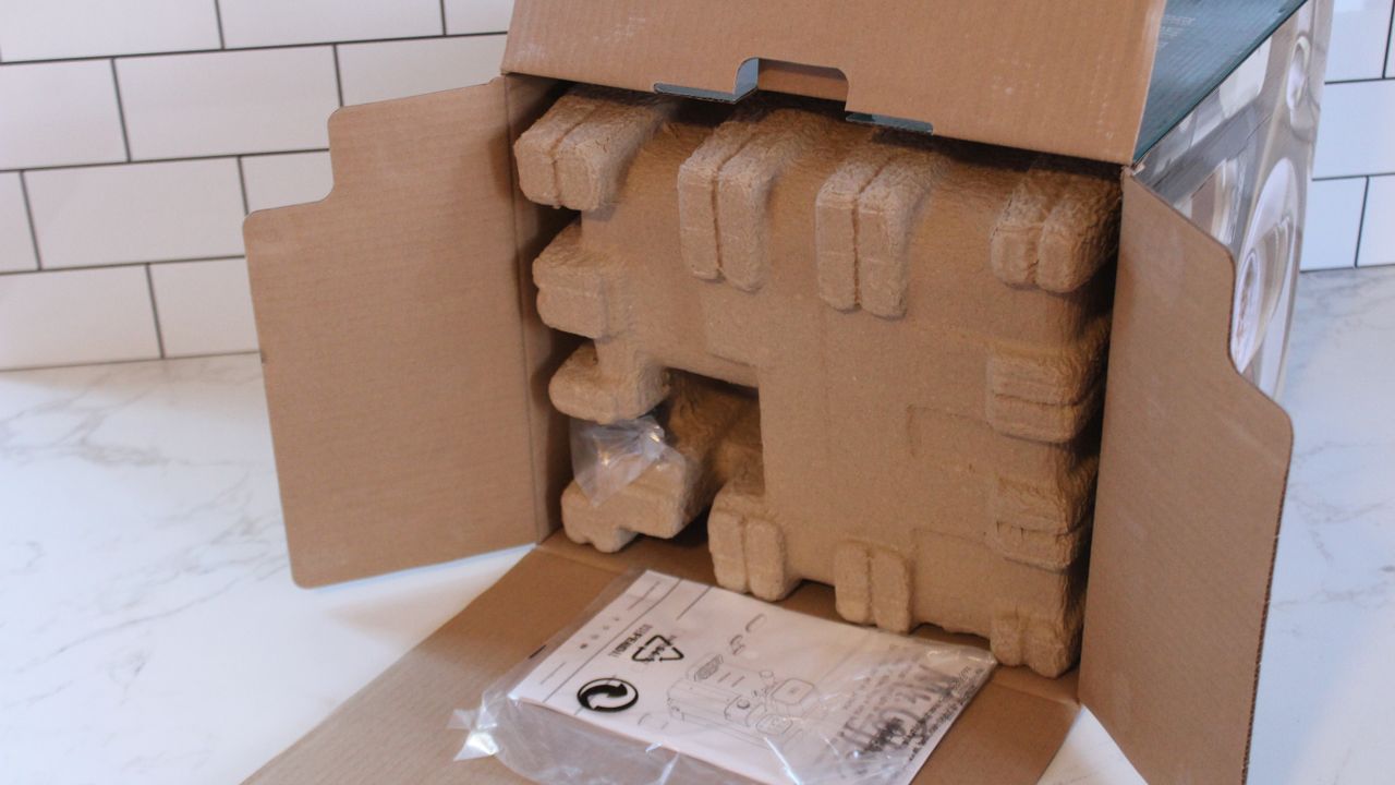 opening the box to the mr coffee prima luxe