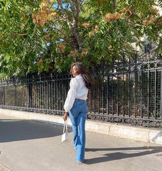 Flared jeans with white kitten heels